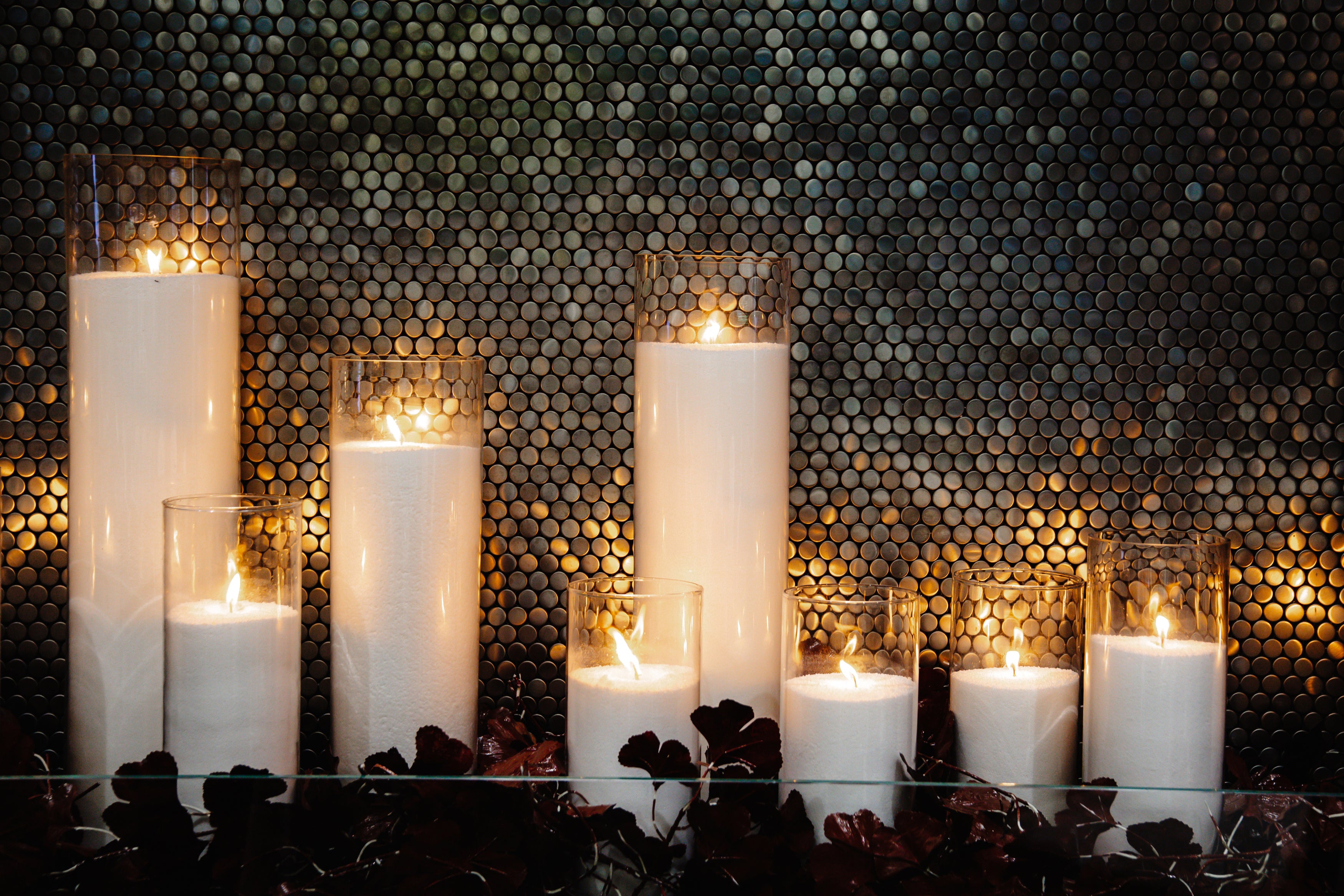 Glass vases filled with candle beads